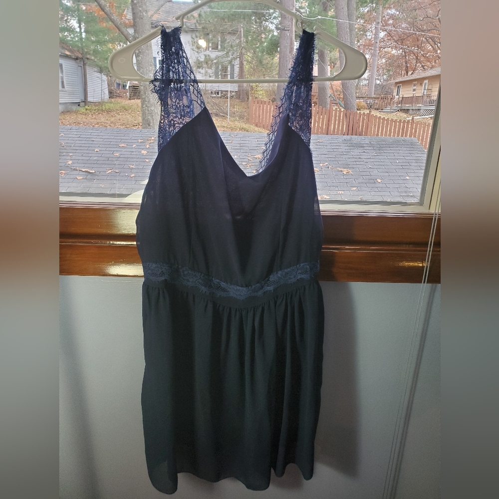 Navy blue dress with lace detail sleeves.